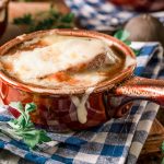 French onion soup with cheese melted on top